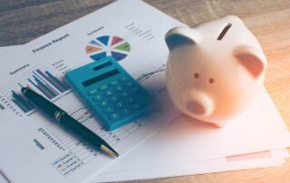piggy bank with financial report on table